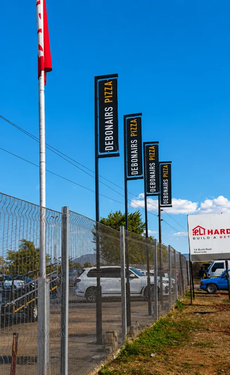 Debonairs Pizza branded flags and outdoor display manufactured and installed by Sign Image — project photo 2