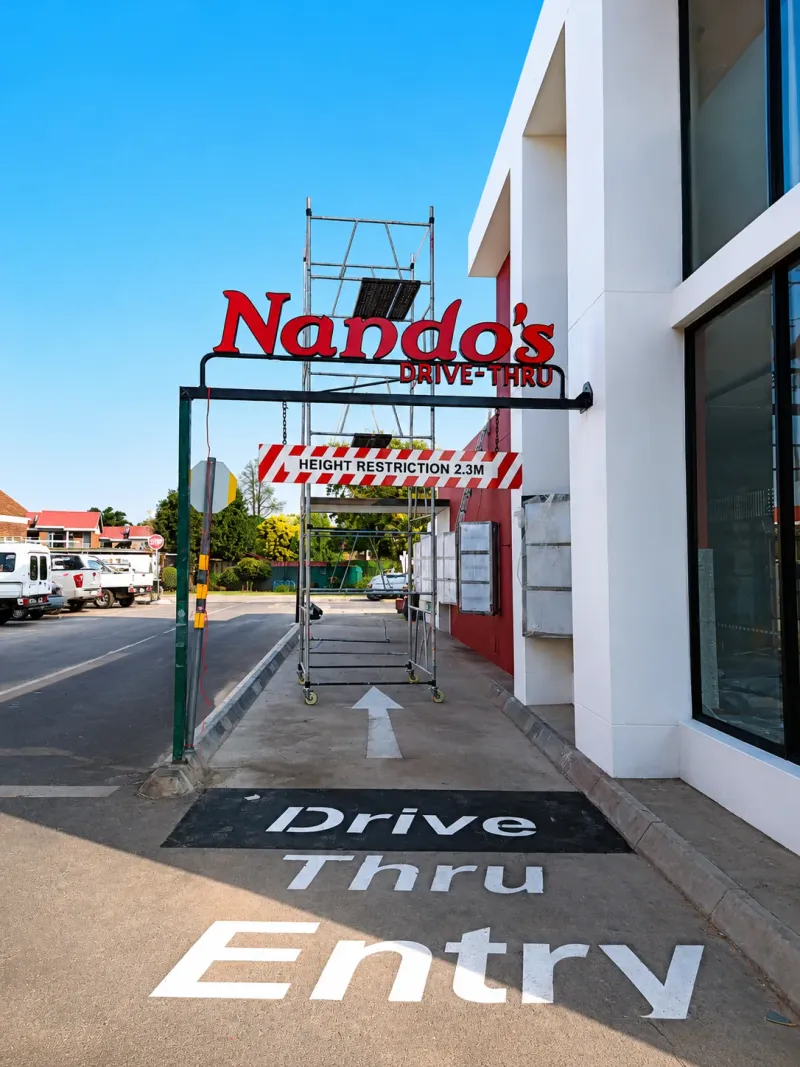 Nando’s wayfinding and directional signage manufactured and installed by Sign Image — project photo 9