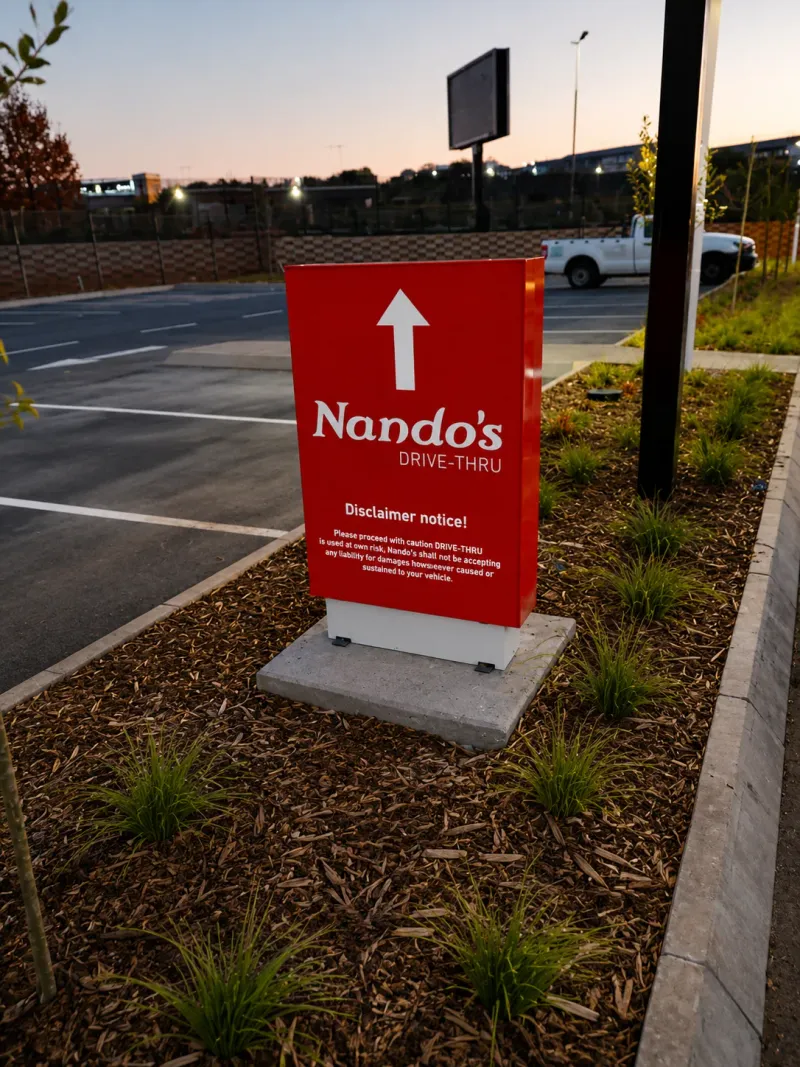 Nando’s wayfinding and directional signage manufactured and installed by Sign Image — project photo 16