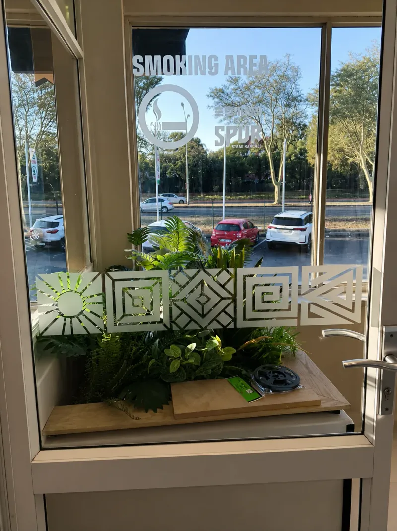 Spur Steak Ranches window and frosted decal graphics manufactured and installed by Sign Image — project photo 18