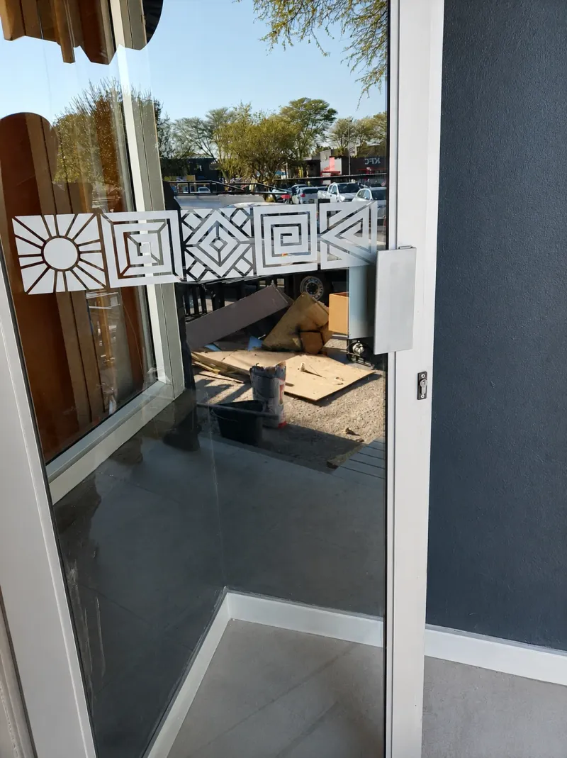 Spur Steak Ranches window and frosted decal graphics manufactured and installed by Sign Image — project photo 19